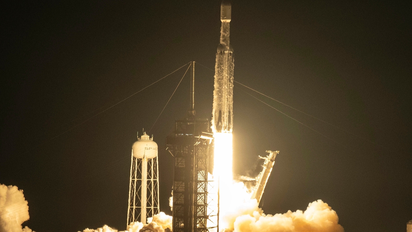 SpaceX's powerful falcon heavy rocket lofts secretive US military spaceplane into orbit